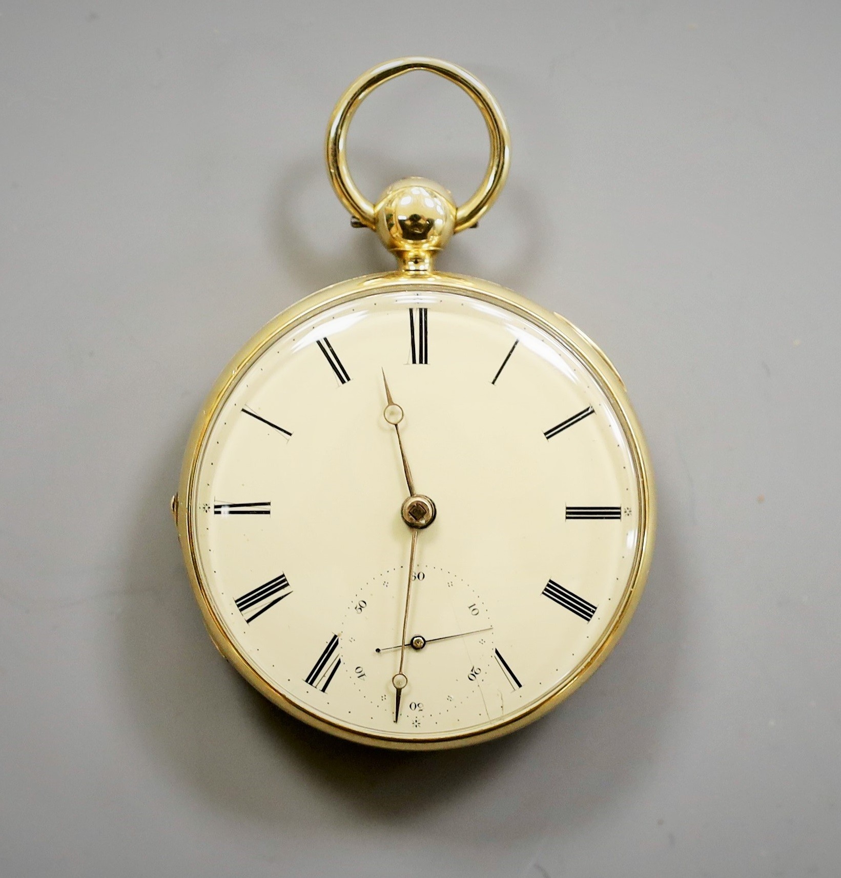 An 18ct gold open faced keywind pocket watch, by K.H. Jones, Liverpool, with Roman dial and subsidiary seconds, case diameter 46mm